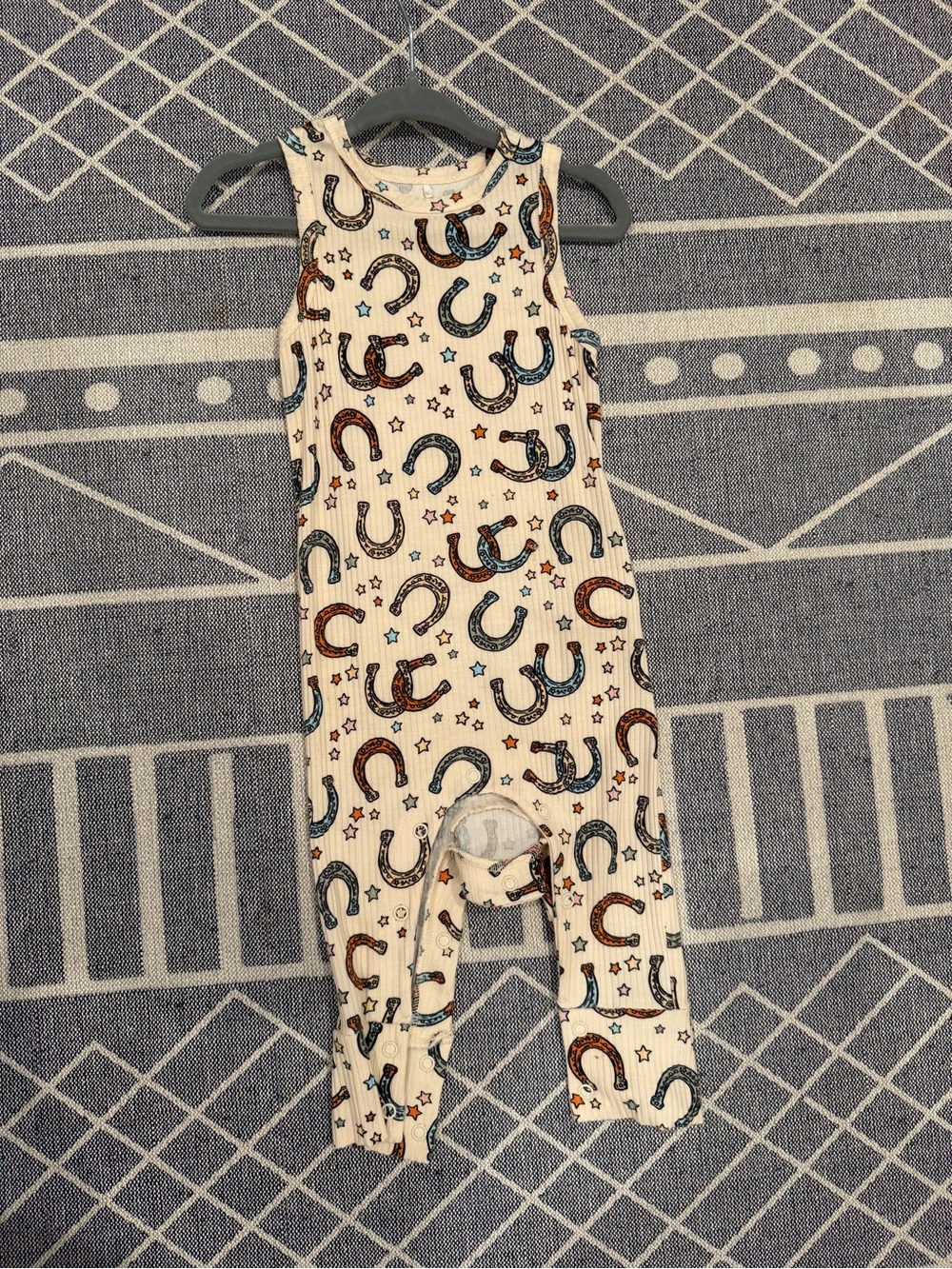 Posh Peanut Cream Ribbed One-Piece with Brown and Blue Horseshoe Print
